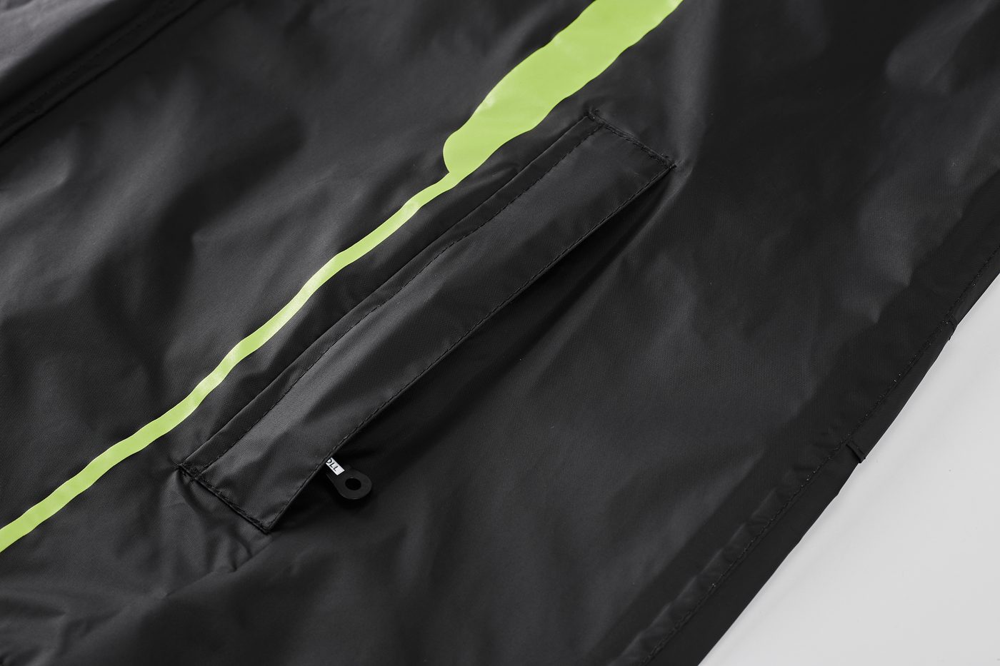 Waterproof slanted chest pocket with green accent stripe