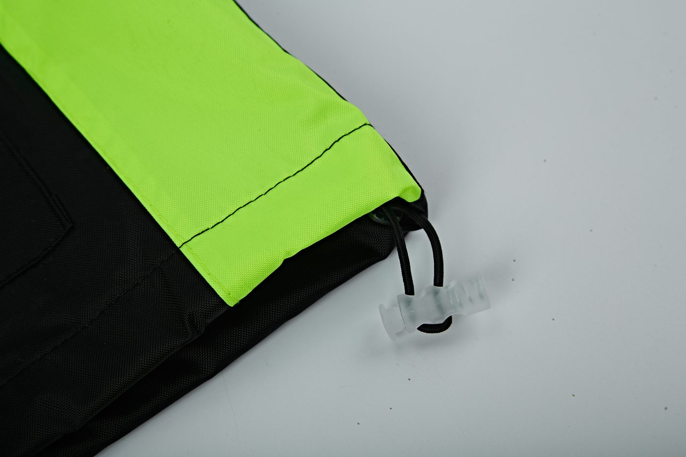 Hem drawcord with toggle lock