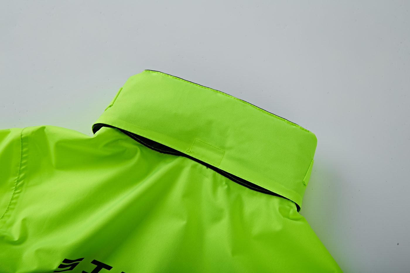 Neon green contrast trim at hem/cuff