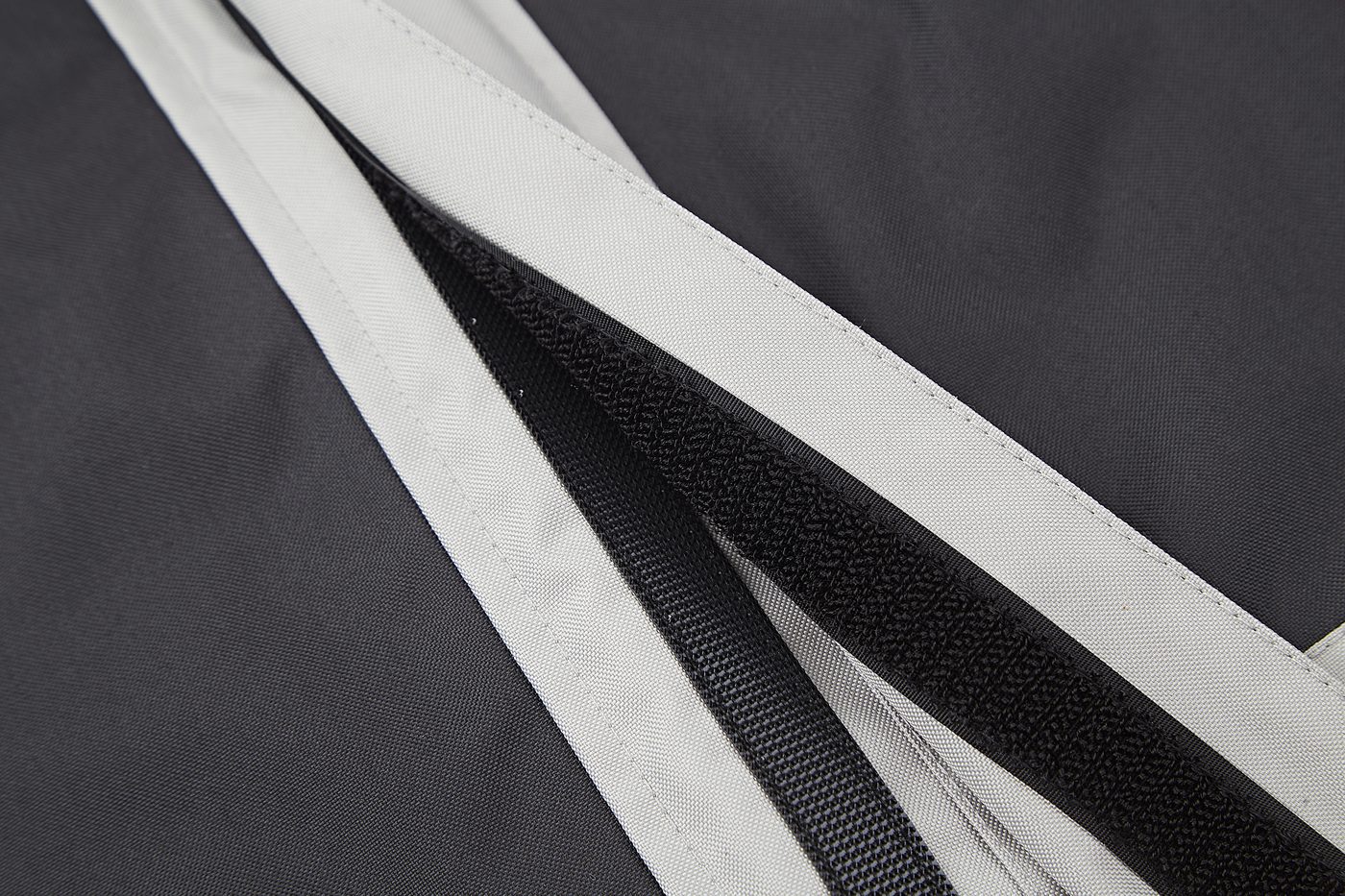 Front closure with grey storm flap over black contrast panel