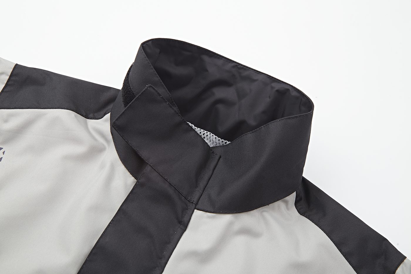 Collar-to-hood junction with mesh liner and storm flap