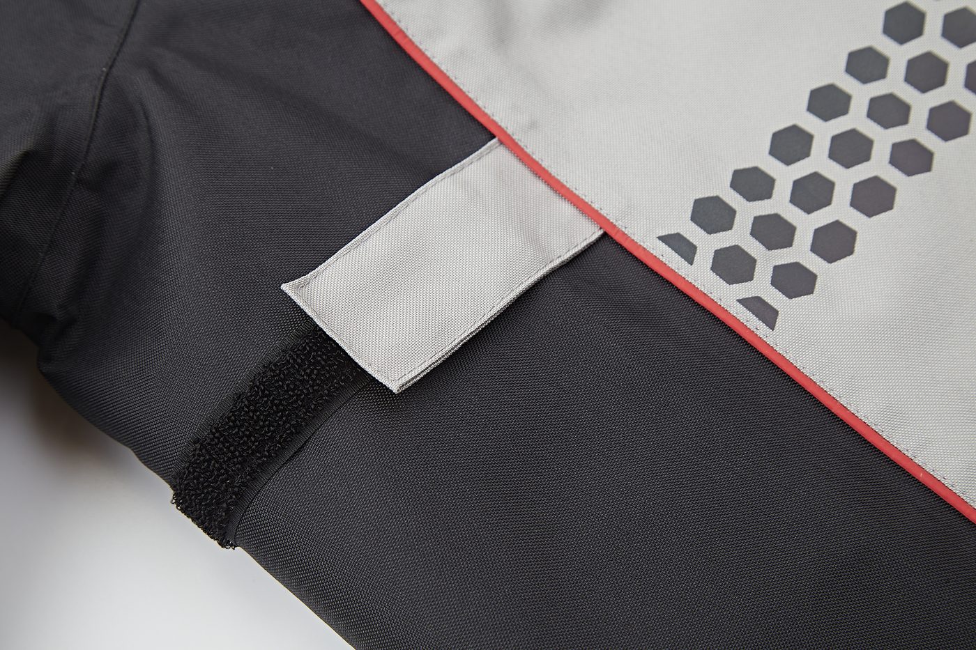 Honeycomb reflective print on the sleeve with black reflective trim